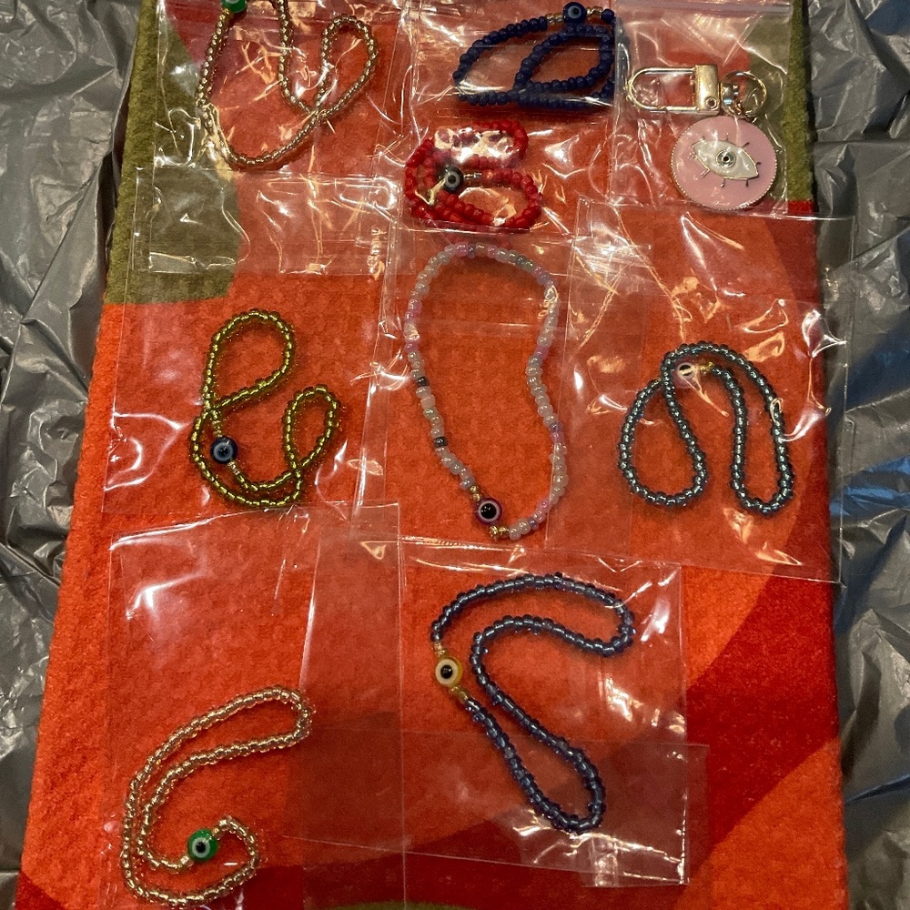 Lot of 12 evil eye seed bracelets & 1 evil eye  Keychain or bag charm.